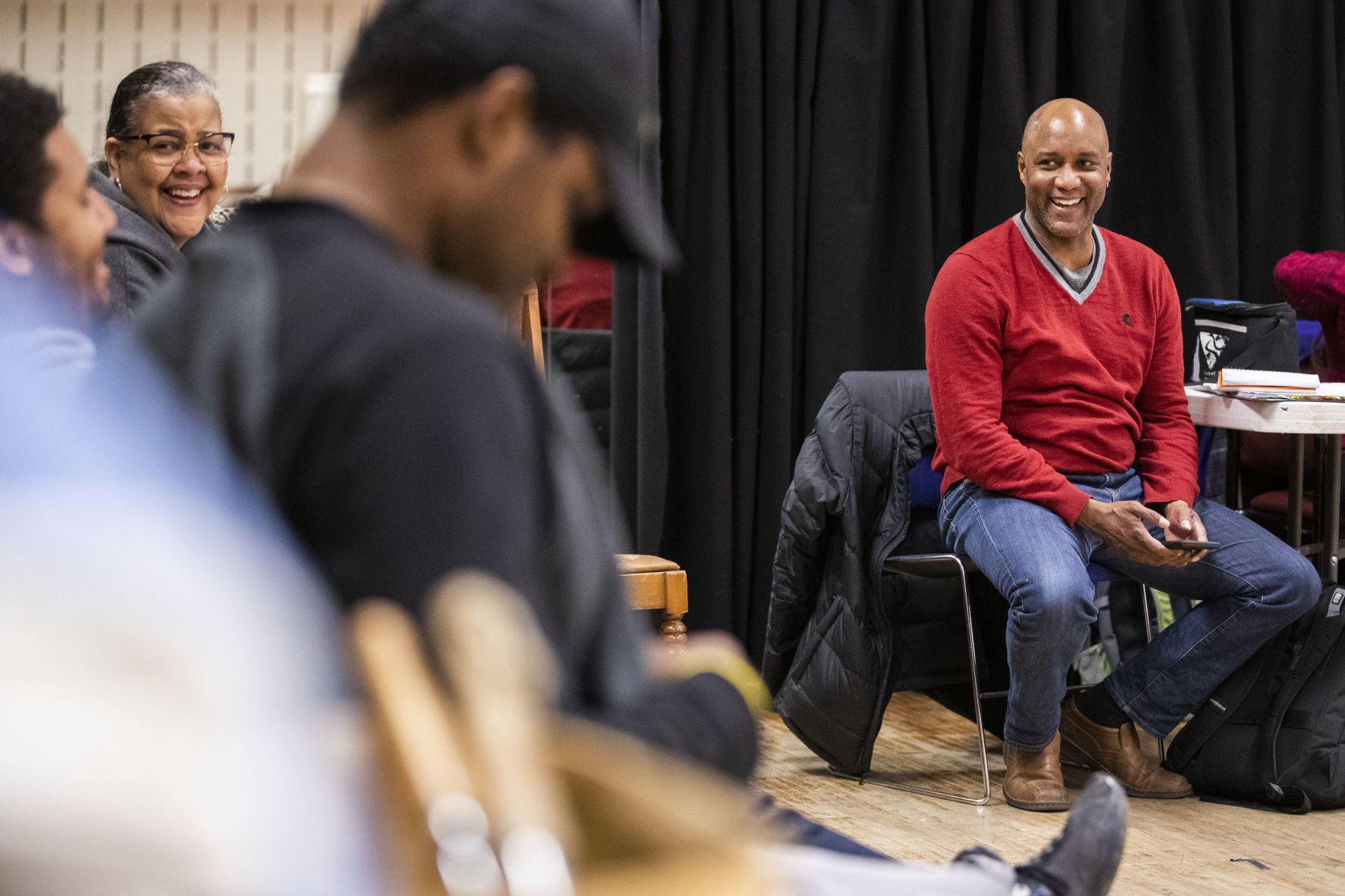 Tyrone Beasley talks with members of the cast, including Karen Fox.